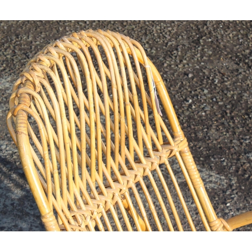 128 - A retro bamboo and wicker rocking chair, strongly in the manner of Franco Albini, approx 56cm wide x... 