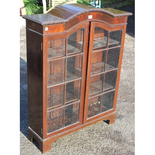 131 - An early 20th century mahogany bookcase with glazed doors, approx 93cm wide x 28cm deep x 123cm tall