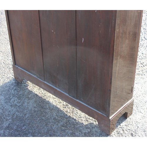 131 - An early 20th century mahogany bookcase with glazed doors, approx 93cm wide x 28cm deep x 123cm tall