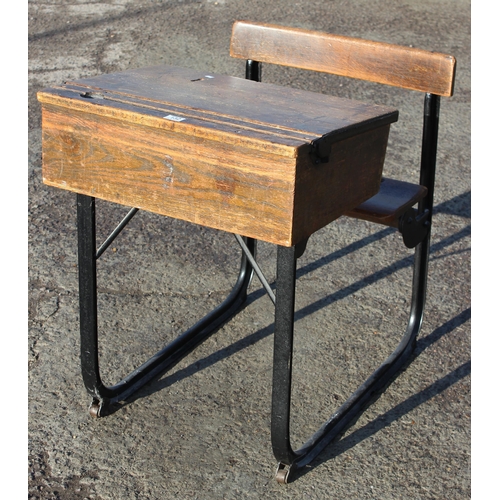 132 - A vintage oak school desk with iron frame by Kingfisher of West Bromwich, approx 62cm wide x 82cm de... 