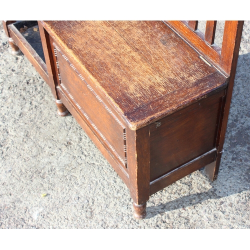 133 - An early 20th century oak hall stand with stick stand and storage seat, approx 97cm wide x 31cm deep... 