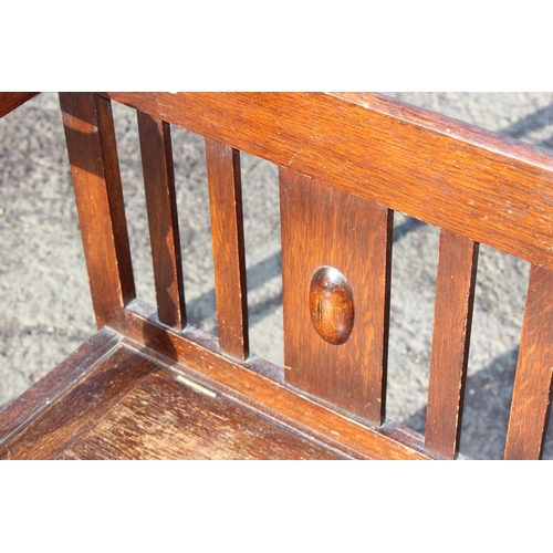 133 - An early 20th century oak hall stand with stick stand and storage seat, approx 97cm wide x 31cm deep... 