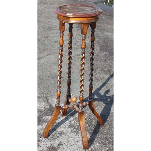 134 - An early 20th century oak jardiniere stand with barleytwist supports, approx 35cm in diameter x 105c... 