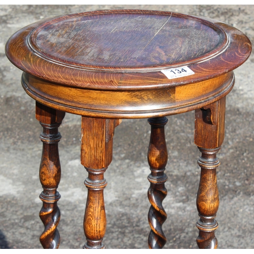 134 - An early 20th century oak jardiniere stand with barleytwist supports, approx 35cm in diameter x 105c... 