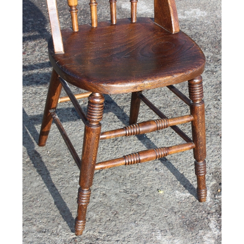 135 - A vintage elm seated chair with stick back, c.1900