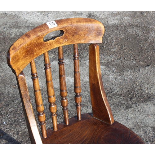 135 - A vintage elm seated chair with stick back, c.1900