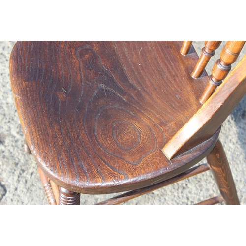 135 - A vintage elm seated chair with stick back, c.1900