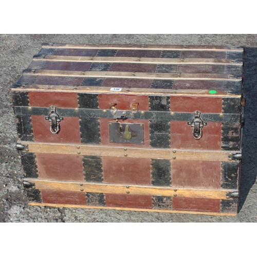 136 - An early 20th century antique iron and wooden banded shipping trunk with flat top, approx 81cm wide ... 