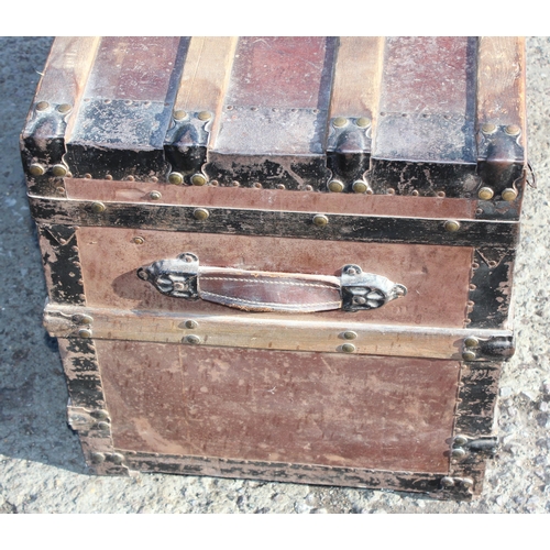 136 - An early 20th century antique iron and wooden banded shipping trunk with flat top, approx 81cm wide ... 