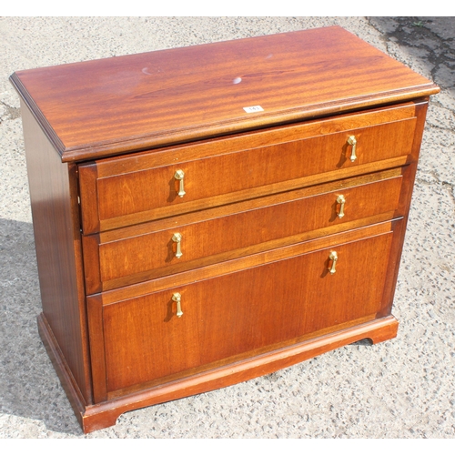 143 - A vintage Meredew 3 drawer chest of drawers and a small leather topped bookcase, the chest of drawer... 