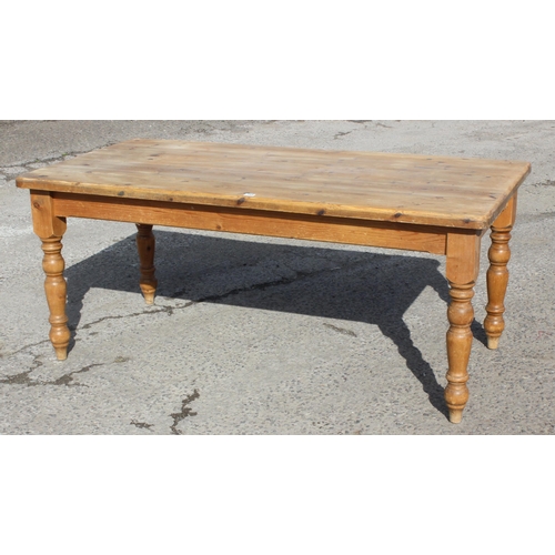 145 - A large pine farmhouse kitchen table, approx 180cm wide x 92cm deep x 78cm tall