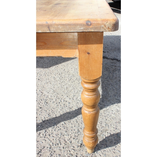 145 - A large pine farmhouse kitchen table, approx 180cm wide x 92cm deep x 78cm tall