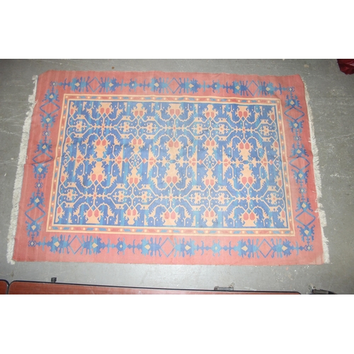 202 - A vintage blue, red and orange ground flat weave Afghan kilim rug, approx 275cm x 190cm