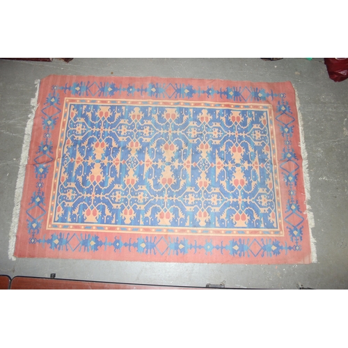 202 - A vintage blue, red and orange ground flat weave Afghan kilim rug, approx 275cm x 190cm