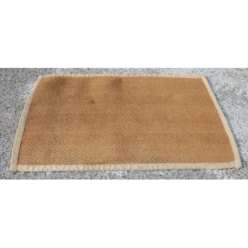 205 - A large brown hessian style rug, approx 158cm x 100