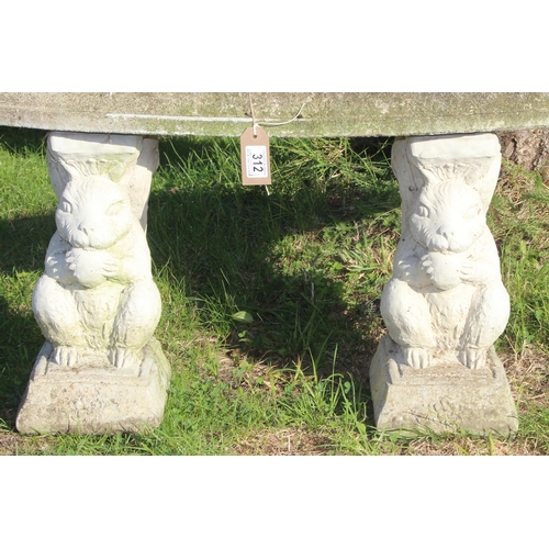 312 - Concrete garden bench with squirrel supports, approx 98cm wide