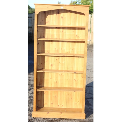 69 - A large modern pine open bookcase, approx 88cm wide x 25cm deep x 192cm tall