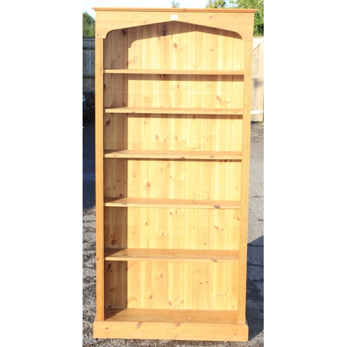 69 - A large modern pine open bookcase, approx 88cm wide x 25cm deep x 192cm tall