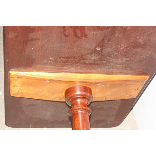 74 - An antique mahogany side table on tripod base, approx 76cm wide x 50cm deep x 73cm tall