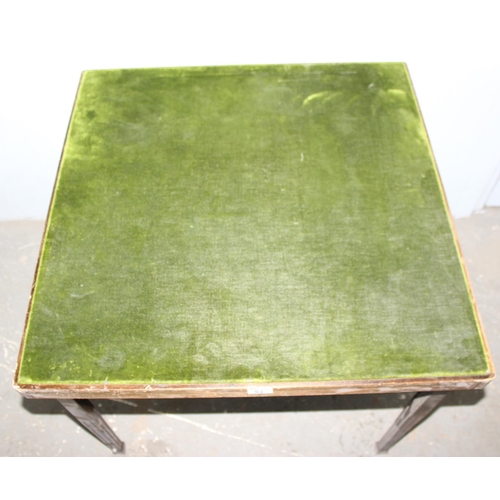 75 - A vintage folding felt topped card table, approx 76cm square x 68cm tall