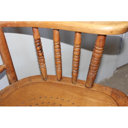 76 - An early 20th century armchair with bentwood seat and turned supports