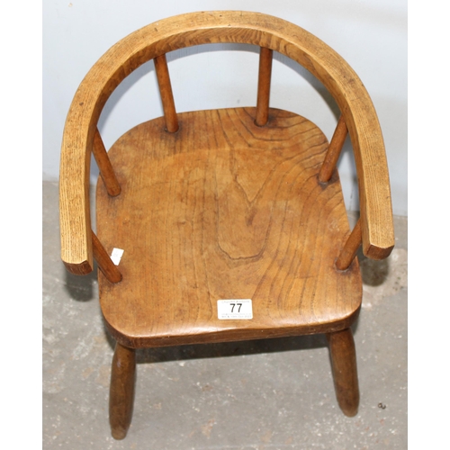 77 - A vintage Elm child's horseshoe chair, likely early 20th century, approx 48cm tall