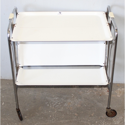 79 - A retro folding white Formica and chrome folding tea trolley, approx 66cm wide x 42cm deep x 71cm ta... 