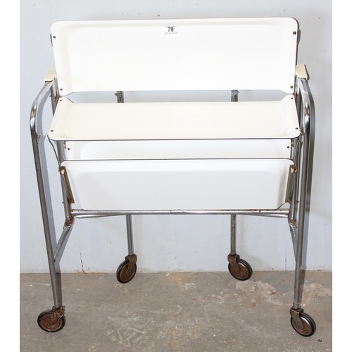 79 - A retro folding white Formica and chrome folding tea trolley, approx 66cm wide x 42cm deep x 71cm ta... 