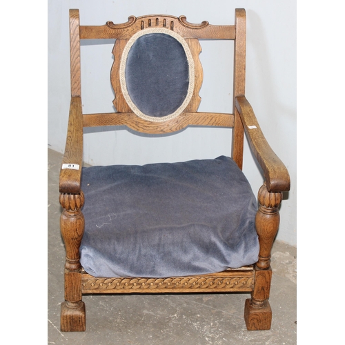 81 - An Art Deco period oak low chair with blue upholstery