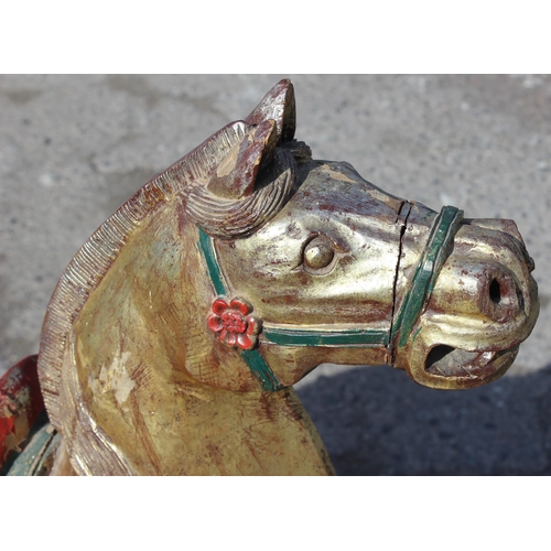 96 - Pair of large floor standing Chinese carved wooden horses with gilt and polychrome decoration, model... 