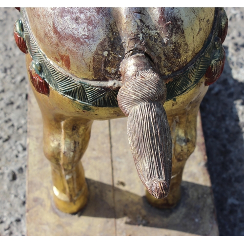 96 - Pair of large floor standing Chinese carved wooden horses with gilt and polychrome decoration, model... 