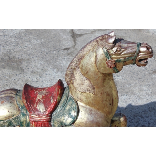 96 - Pair of large floor standing Chinese carved wooden horses with gilt and polychrome decoration, model... 