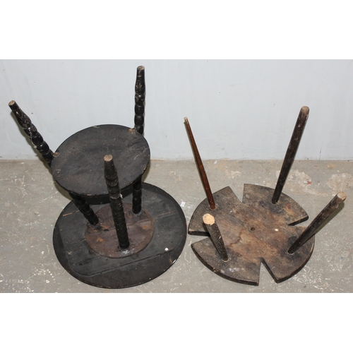 148 - A small antique ebonised tripod table with bobbin turned legs and an unusual Maltese cross shaped oa... 