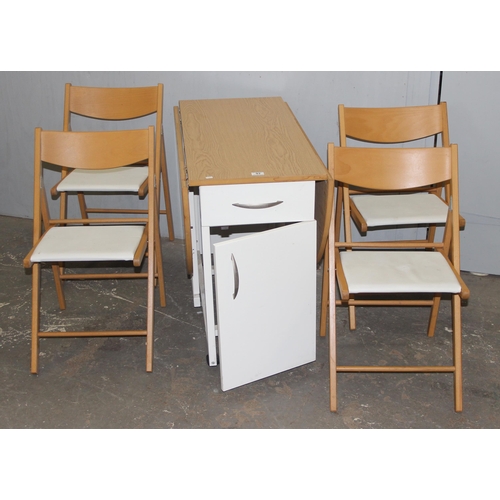 92 - A modern drop leaf table and 4 chairs, the chairs stowing away in the base of the table, approx 104c... 