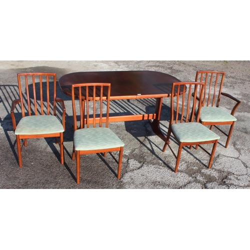 93 - A retro McIntosh extending dining table and 4 chairs, the table approx 158cm wide x 92cm deep x 76cm... 