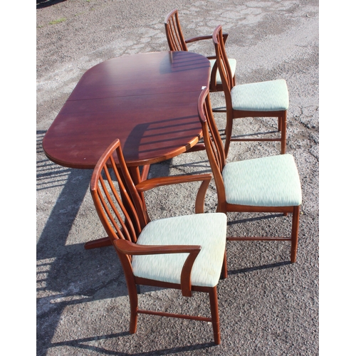 93 - A retro McIntosh extending dining table and 4 chairs, the table approx 158cm wide x 92cm deep x 76cm... 