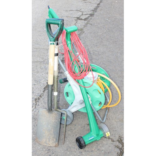 334 - Garden hose on reel, spade, fork and electric edger (4)