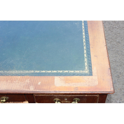 141 - An early 20th century mahogany 3 piece pedestal desk with brass handles and green tooled leather top... 