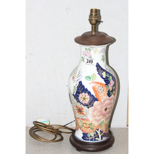 249 - Colourful hand painted floral vase converted into a lamp with wooden base, approx 50cm tall