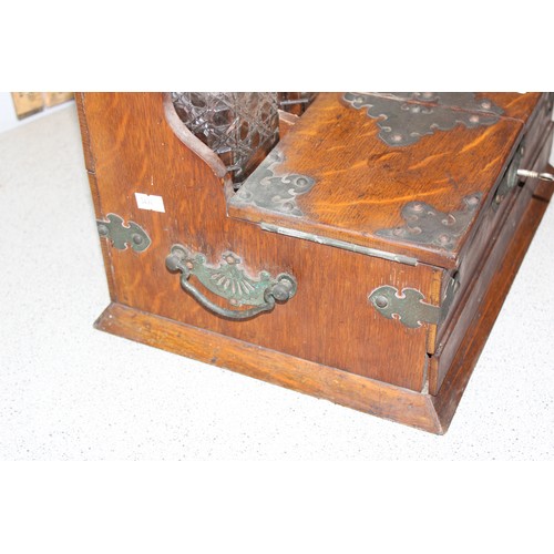 283 - Antique oak tantalus with brass fittings with 3 matching cut glass decanters and shot glasses approx... 