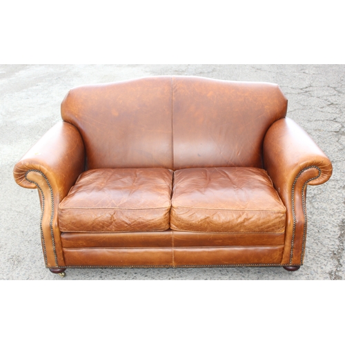 24 - A good quality vintage tan brown leather 2 seater sofa, approx 150cm wide x 94cm deep x 80cm tall