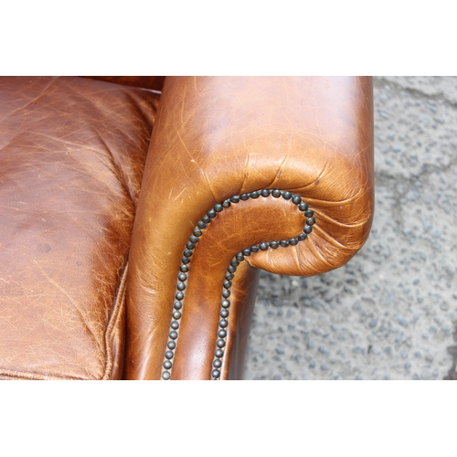 24 - A good quality vintage tan brown leather 2 seater sofa, approx 150cm wide x 94cm deep x 80cm tall