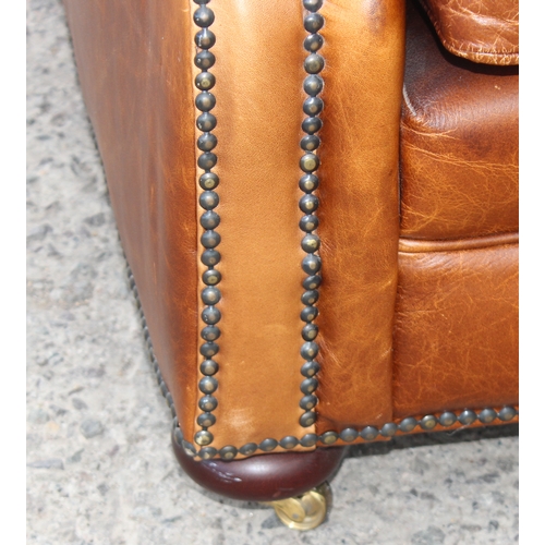 24 - A good quality vintage tan brown leather 2 seater sofa, approx 150cm wide x 94cm deep x 80cm tall