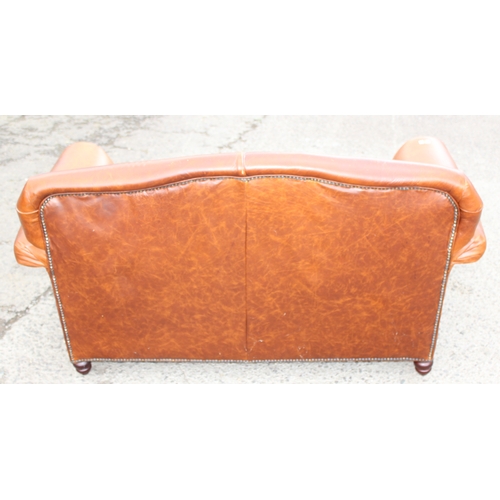 24 - A good quality vintage tan brown leather 2 seater sofa, approx 150cm wide x 94cm deep x 80cm tall