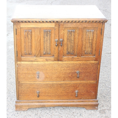 42 - An early 20th century oak 2 drawer hall cupboard in the 17th century style, approx 80cm wide x 48cm ... 