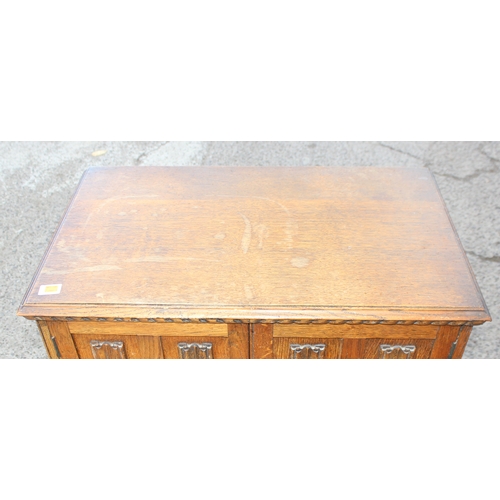 42 - An early 20th century oak 2 drawer hall cupboard in the 17th century style, approx 80cm wide x 48cm ... 