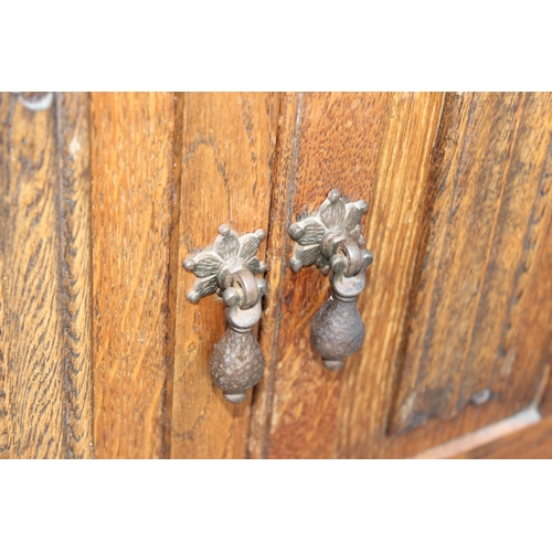 42 - An early 20th century oak 2 drawer hall cupboard in the 17th century style, approx 80cm wide x 48cm ... 