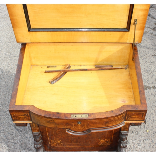 51 - A Victorian figured walnut kneehole writing Davenport, having a gilt tooled leather inset writing su... 