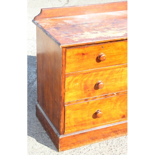 44 - An antique mahogany 2 over 2 chest of drawers with bun handles, approx 117cm wide x 55cm deep x 90cm... 