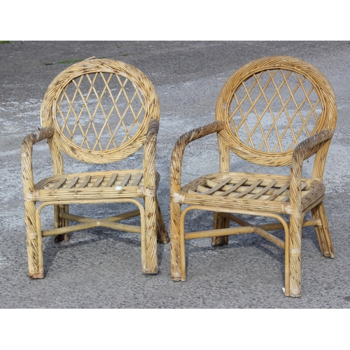 111 - A pair of vintage bamboo and wicker garden or conservatory chairs